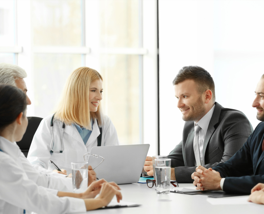 group of business people and medical professionals meeting